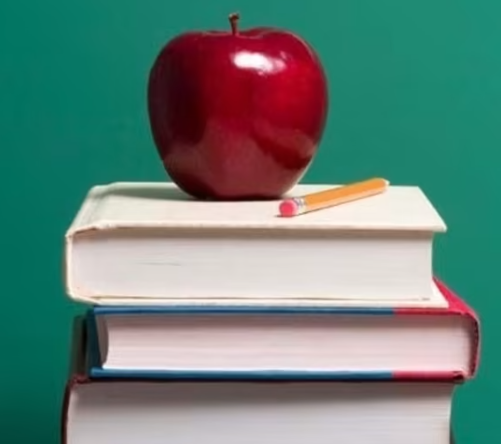 image of apple on stack of books